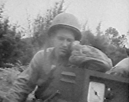Pacific GI in WW II listens to radio