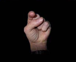 fist with finger pointing back at you